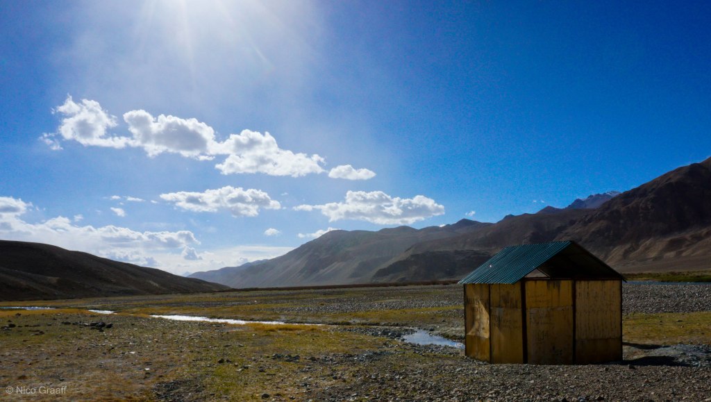Hot Natural Bath Tube inside this unimpressing hut